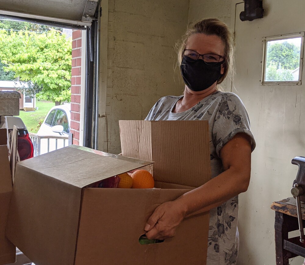Female volunteer holding box