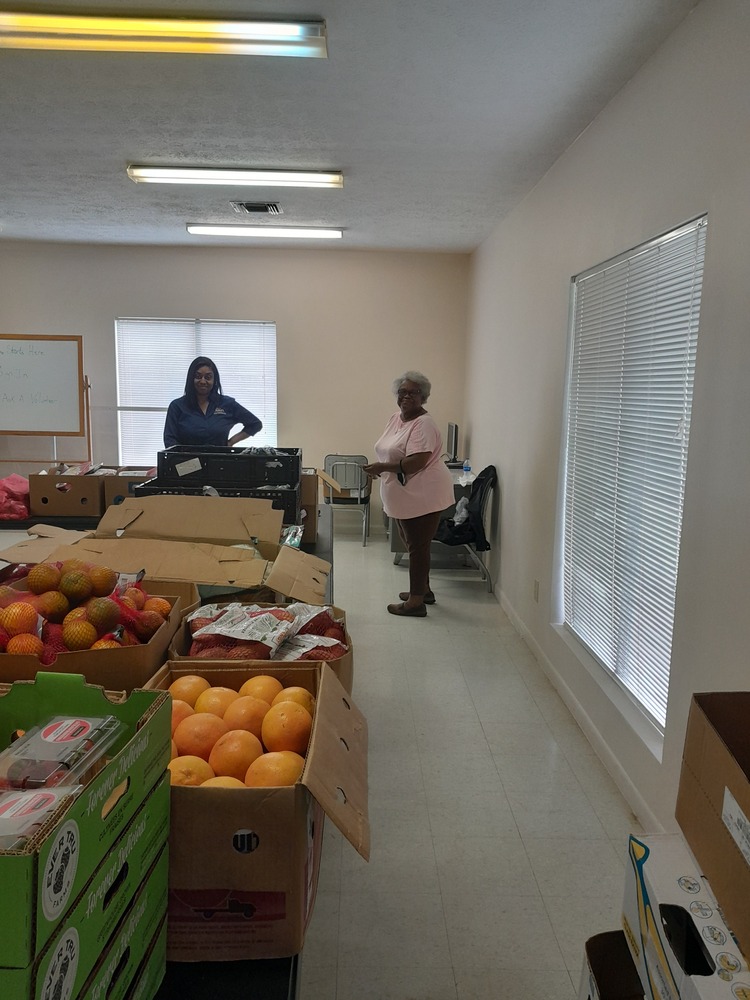 LHA Farmers market staff sorting fruit boxes