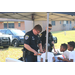 Police officers helping kids at table at the Operation CommUNITY event