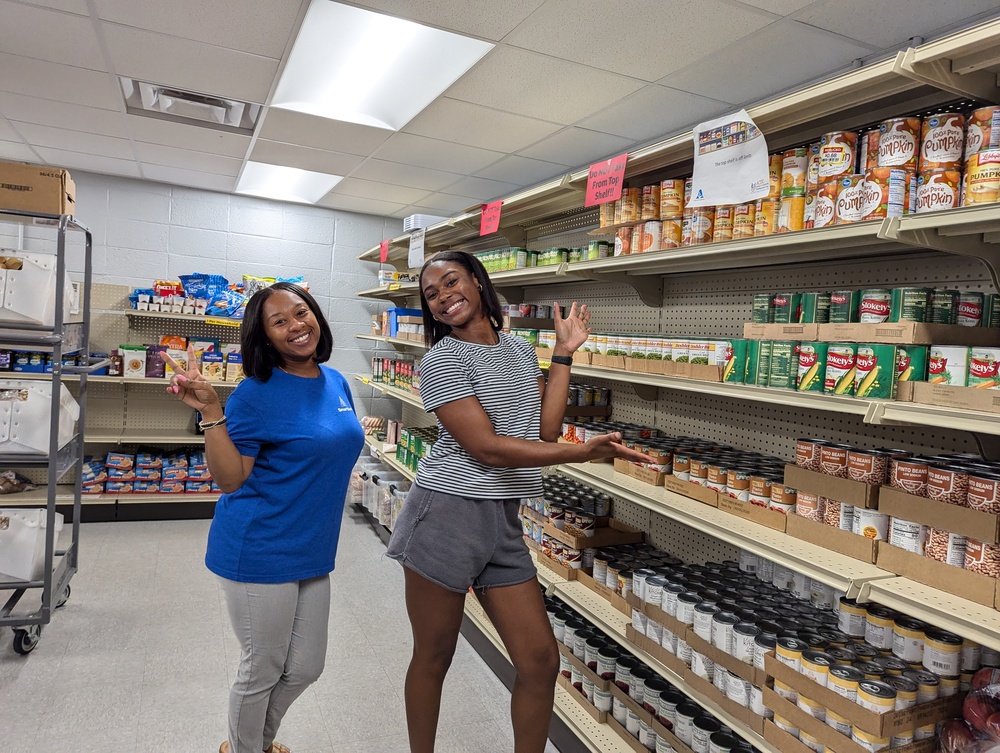 Summer Boykin Food Pantry Volunteers in aisle 