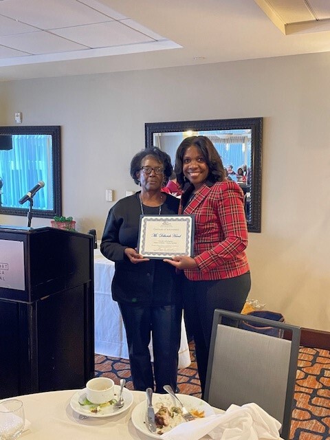 Commissioner Deborah Hand with CEO Tolbert at the Chistmas luncheon