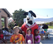 Youth National Night Out attendees posing with the Chick-fil-a cow mascot. 