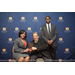 CEO Sharon Tolbert holding plaque with guest and son at 2018 MLK Scholarship Breakfast