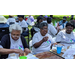 elderly guest eating and posing for camera