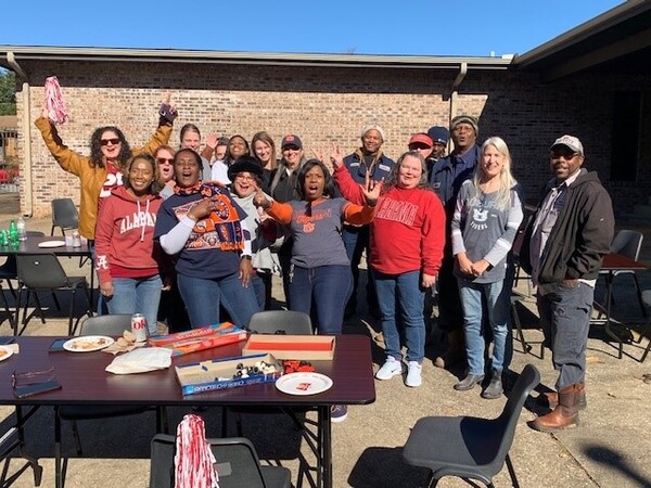 Iron Bowl Tailgate Group of Employees, Commissioners posing in team gear 