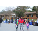 Mother and children walking away from the vendor tables at the Operation CommUNITY event