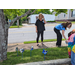 People placing pinwheels on lawn