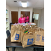 School supplies in Aldi bags on table