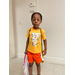 Boy standing in front of white wall at Back to School supply giveaway in the Sparkman Community.