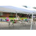 Tables with school supplies under tents