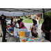 Youth under tent selecting school supplies