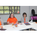 Auburn Housing Authority staff members posing behind desk at Employee Meeting