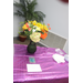 Gift table for Charlotte Mattox that includes a vase of flowers