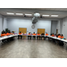 Auburn Housing Authority Employees sitting in a large room around a U-shaped desk