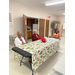 Three elderly women at the Christmas luncheon sitting around table