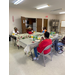 senior residents sitting at tables